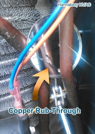 Copper rub-through from two lines touching over the years. copper refrigerant lines rubbed together