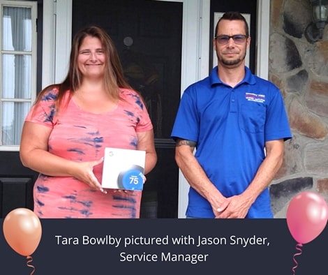 Tara Bowlby and Jason Snyder with Nest thermostat