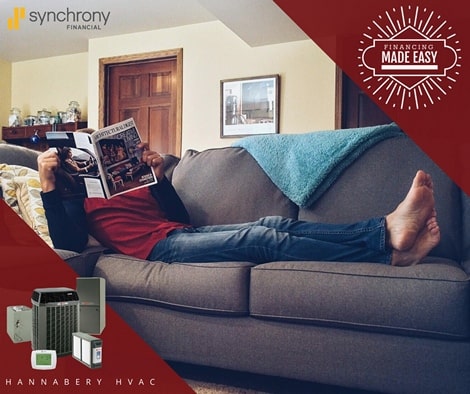 man reading magazine on couch