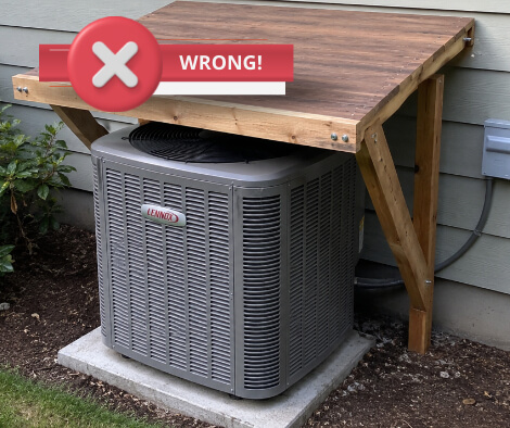 Wooden overhang over AC unit