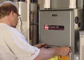 Hannabery HVAC service technician performing a pre-season furnace inspection.