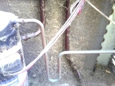 Dirty coils reduce airflow, severely decreasing efficiency. outdoor coil blocked with grass clippings