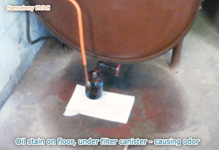 You should never see oil leaking or on the floor around your oil tank or oil burner. oil leak from filter canister causing odor